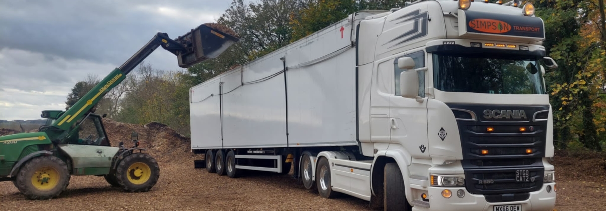 Loading lorry with wood chip - site clearance