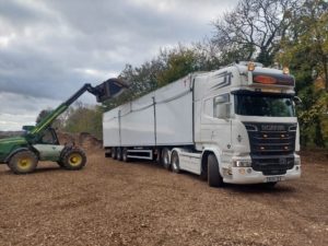 Loading lorry with wood chip - site clearance